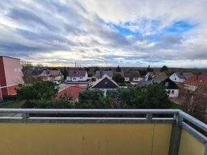 a view of a town with houses and a cloudy sky at Gästewohnung KL. WZL 33_7 in Klein Wanzleben