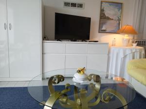 a living room with a glass table with a cake on it at Villa Spanja in Vodice +54 photos