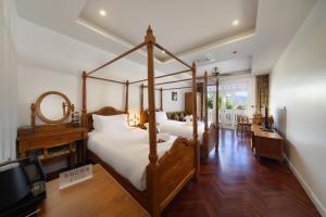 Ліжко або ліжка в номері Lanna Inthan Resort