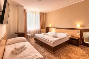 Postel nebo postele na pokoji v ubytování Congress Hotel Centrum