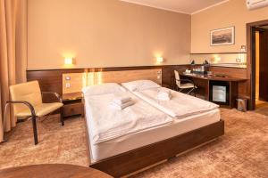 Postel nebo postele na pokoji v ubytování Congress Hotel Centrum