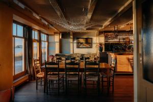 a dining room with a table and chairs at De Durgerdam, Amsterdam in Amsterdam