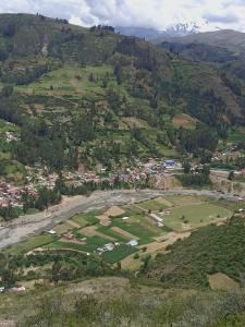 an aerial view of a village on a mountain at casa montañista lodge & camping in Huaraz