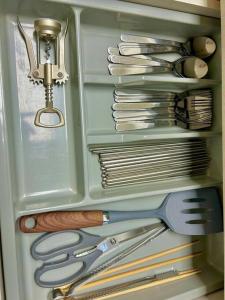 a drawer filled with lots of kitchen utensils at Raon house in Suwon