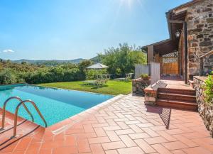 a swimming pool in the backyard of a house at Le Masse in Greve in Chianti