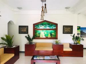 a living room with two couches and a table at Kandy City Village in Kandy