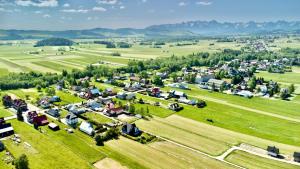 an aerial view of a small village in a field at Apartament Janusza in Gronków +9 photos