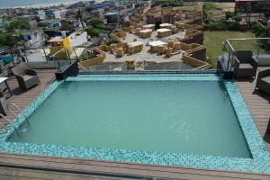 an overhead view of a swimming pool at a resort at Pipul Ocean View Resort in Puri