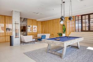 a living room with a pool table in it at Dumbo 1br w gym roof nr TimeOut Building NYC-958 in Brooklyn