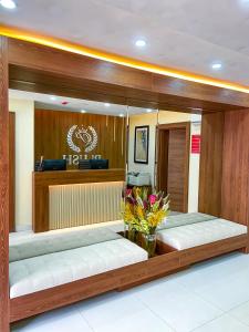 a room with two benches in a building at Plush Hotel,Abuja in Abuja