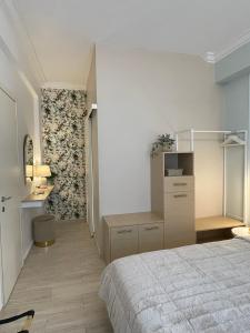 a bedroom with a bed and a desk in it at Syntagma Hideaway Luxury Apt in Athens