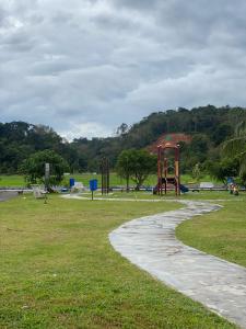 a park with a playground with a slide at Homestay Desa Tikam batu in Sungai Petani