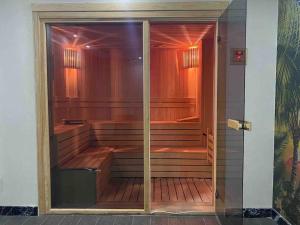 an empty sauna in a building with a glass door at Retro 3 in Alanya +11 photos
