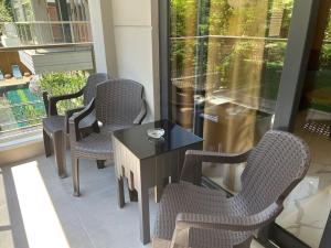 a group of chairs and a table on a balcony at Retro 3 in Alanya