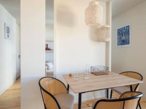 a dining room with a wooden table and chairs at Hoppersgr- Amazing apt in the heart of Athens - 1 in Athens