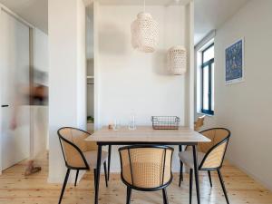 a dining room with a table and chairs at Hoppersgr- Amazing apt in the heart of Athens - 1 in Athens