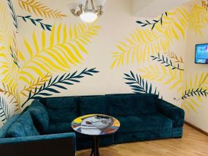 a living room with a couch and a table at Areva Hostel & Apartment in Yerevan