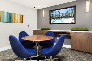 a conference room with a table and blue chairs at Playa Vista 1br w pool wd gym nr beach LAX-930 in Los Angeles