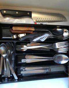 a drawer filled with cooking utensils in a drawer at Clare to Spalding character escape in Spalding