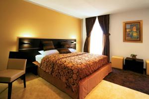 Posteľ alebo postele v izbe v ubytovaní Hotel Marina