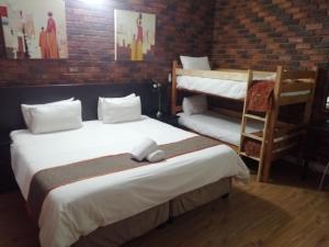 24 Onvrey Guest House tesisinde bir odada yatak veya yataklar