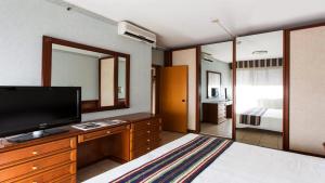 TV a/nebo společenská místnost v ubytování Ripamonti Residence & Hotel Milano
