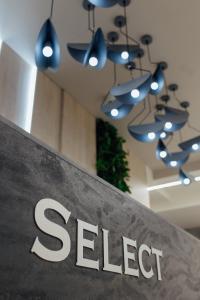a sign with the word steel hanging from the ceiling at Select Hotel in Lviv