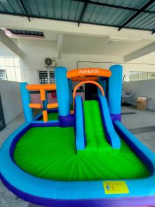 a bounce house on an inflatable play set at FIRASH HOMESTAY AT SERI ISKANDAR in Seri Iskandar