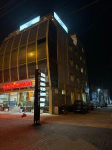 a building with a sign in front of it at night at Hotel Northwind Mohali in Mohali