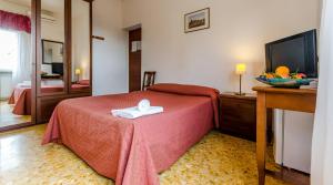 Postel nebo postele na pokoji v ubytování Hotel Antico Acquedotto