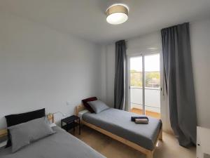 Postel nebo postele na pokoji v ubytování Apartamento Happy Days + 37 fotografií