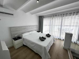 Katil atau katil-katil dalam bilik di A H Rentals Van Gogh apartamento