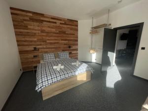 Postel nebo postele na pokoji v ubytování Apartmány Svatý Mikuláš
