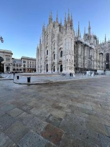 a large stone building with a large cathedral at Victory House in Milan