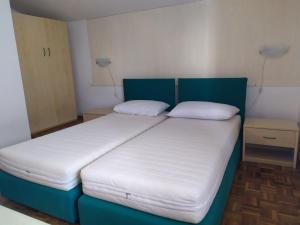 a pair of beds in a small room at Bright villa with private garden - Beahost Rentals in Caorle