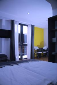 Ένα ή περισσότερα κρεβάτια σε δωμάτιο στο Hotel Time Out in Gudauri