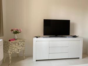 a white cabinet with a television on top of it at HELLO 2 pièces “rénové et climatisé “ Vieil Antibes in Antibes