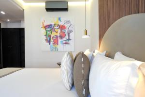 Voodi või voodid majutusasutuse Le M Hôtel toas