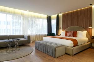 Voodi või voodid majutusasutuse Le M Hôtel toas