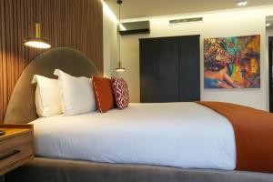 Voodi või voodid majutusasutuse Le M Hôtel toas