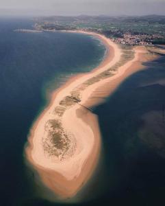 an aerial view of an island in the ocean at Somo Calle Ria Cubas in Somo