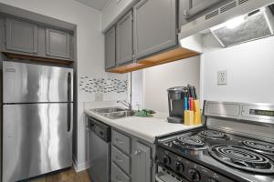 a kitchen with a stainless steel refrigerator and a sink at The Summit 1306 Indoor and Outdoor Pools in Gatlinburg +44 photos