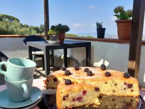 a piece of cake on a plate next to a coffee cup at Casa Allorello in Laureana Cilento