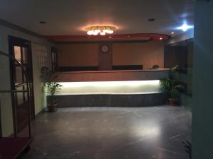 an empty lobby with a stage in a building at Hotel City Inn in Chittagong