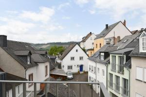 a view of a town with white houses at Style pur: Designer-Wohnung in Top-Lage! in Wittlich