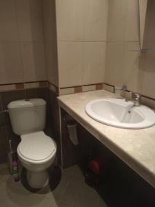 a bathroom with a toilet and a sink at Nessebar, Apartment,South Beach, Larisa, in Nesebar