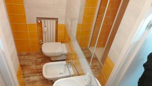Ванна кімната в Nelly Bergamo Apartments