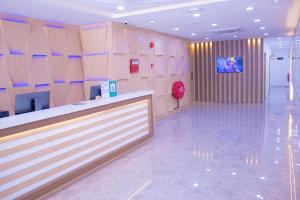 a lobby of a store with a counter and a tv at Astar Hotel Kuala Lumpur in Kuala Lumpur