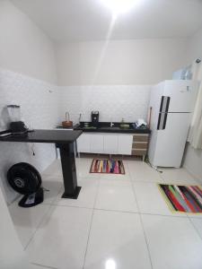 Kuchyň nebo kuchyňský kout v ubytování Residencial Ninho do Curiango