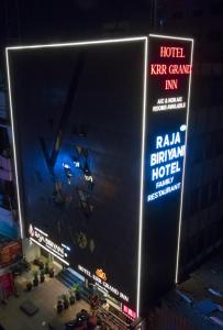 an overhead view of a hotel sign at night at KRR Grand inn in Coimbatore